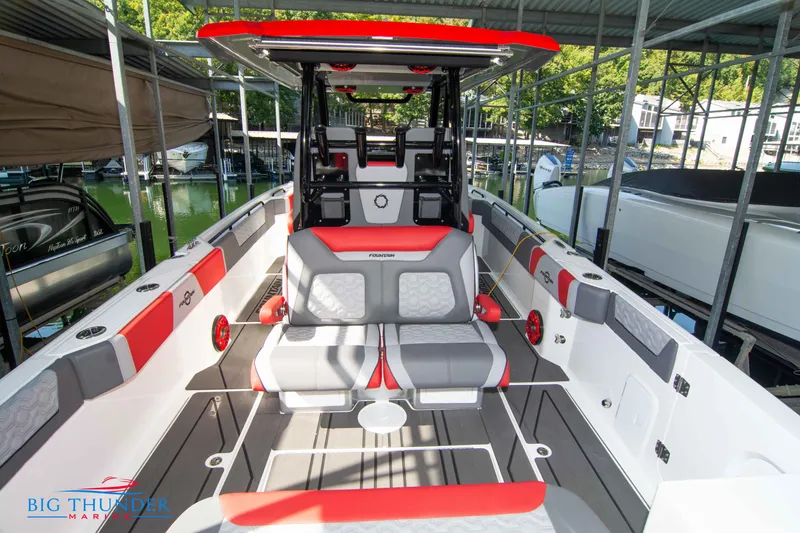 Slide: The Image of The image shows a modern boat with red and gray accents, docked in a covered area. - 17