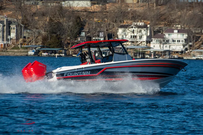 Slide: The Image of Fountain 32 NX 2023 on a lake, featuring a red and black design, speeding through the water. - 3