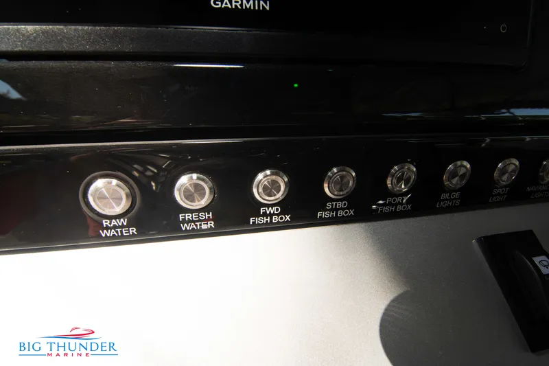 Slide: The Image of Close-up of switches on a boat, including "Raw Water" and "Fresh Water." - 37