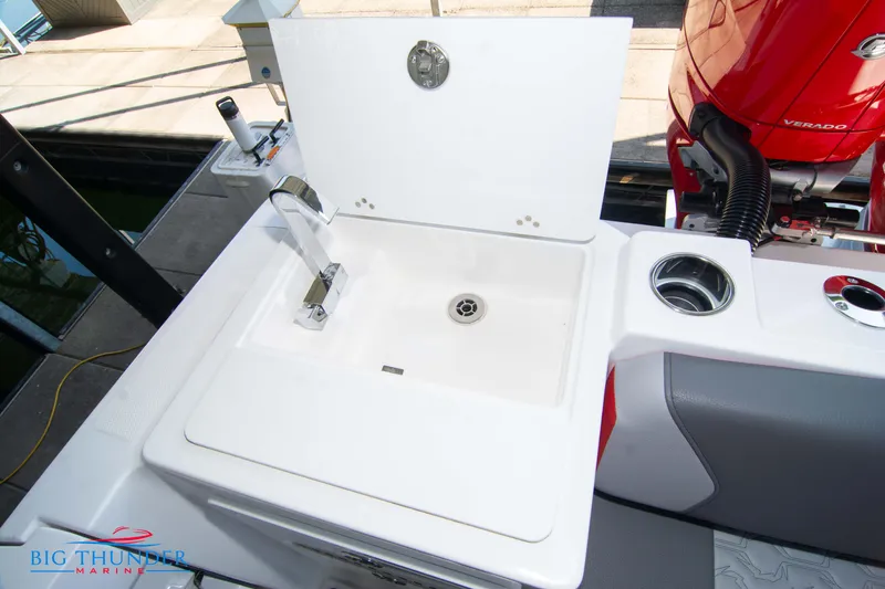 Slide: The Image of The image shows a sink on a boat, surrounded by gray and red elements. - 21