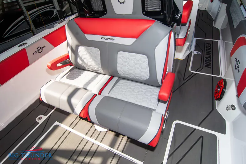 Slide: The Image of Interior of the 2023 Fountain 32 NX with red and gray seating. - 23