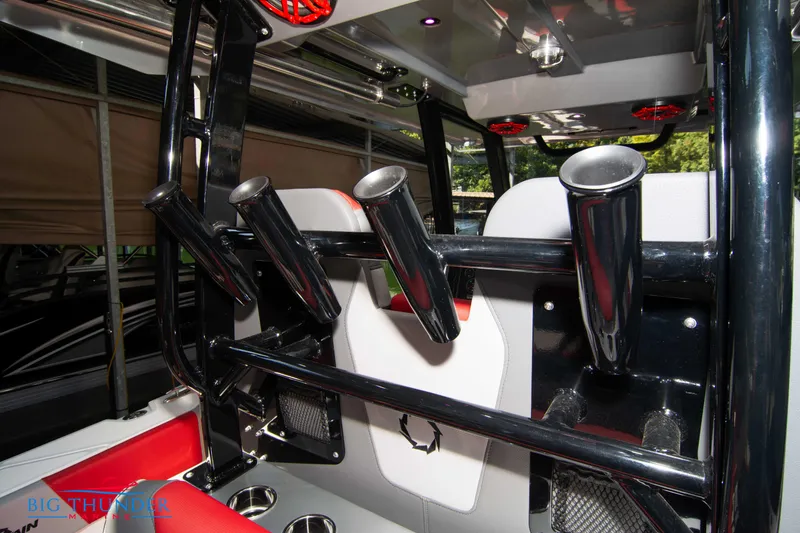 Slide: The Image of The image shows the fishing rod holders on a Fountain 32 NX boat. - 24