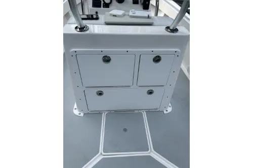 Slide: The Image of 2019 North Coast 190CC boat console with storage compartments and controls. - 4