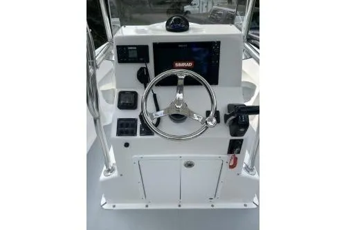 Slide: The Image of 2019 North Coast 190CC boat console with steering wheel and navigation system. - 1