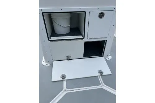 Slide: The Image of 2019 North Coast 190CC boat storage compartments with bucket and secure latches. - 5