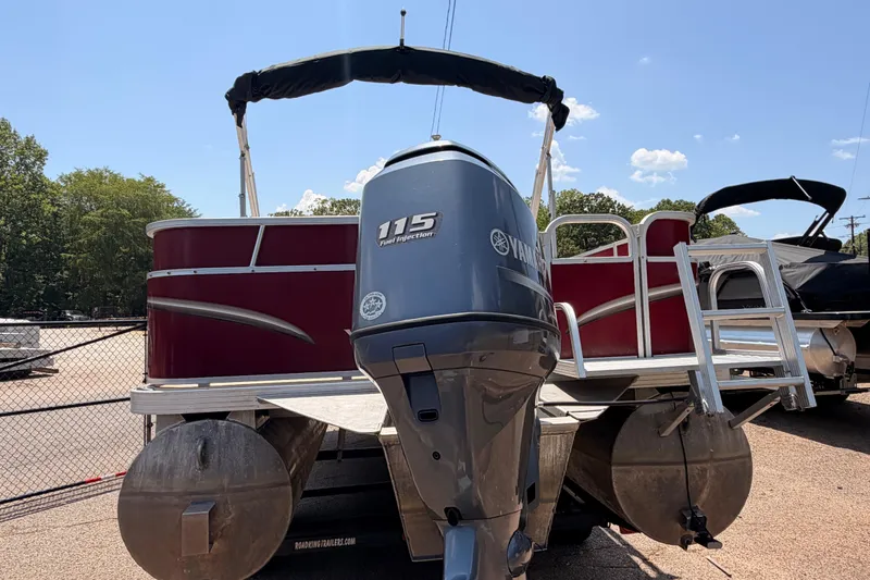Slide: The Image of 2013 Veranda 24 pontoon boat with Yamaha 115 engine, parked outdoors. - 4