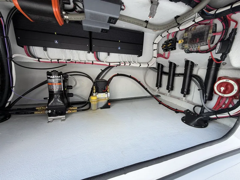 Slide: The Image of Electronics and hydraulic systems inside a boat, featuring cables and components. - 20