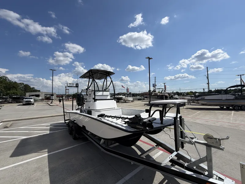 Slide: The Image of A 2026 Dargel 250 Kat HDX on a trailer in a parking lot under a blue sky. - 6