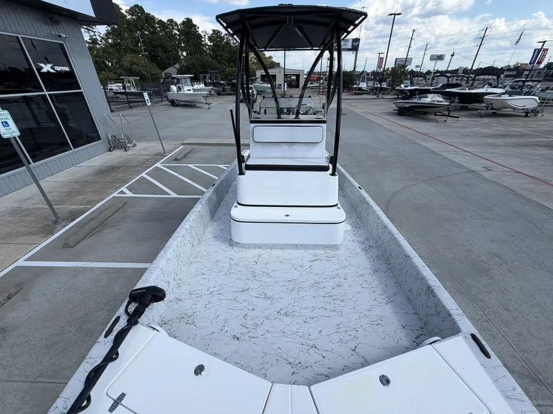 Slide: The Image of The image shows a 2026 Dargel 250 Kat HDX boat with a spacious deck and T-top. - 27
