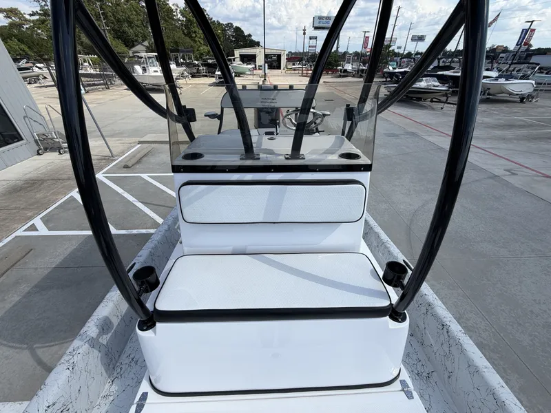 Slide: The Image of The image shows the cockpit of a 2026 Dargel 250 Kat HDX. It features white upholstery and black supports. - 29