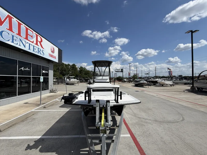 Slide: The Image of A 2026 Dargel 250 Kat HDX on a trailer outside a boat center. - 5