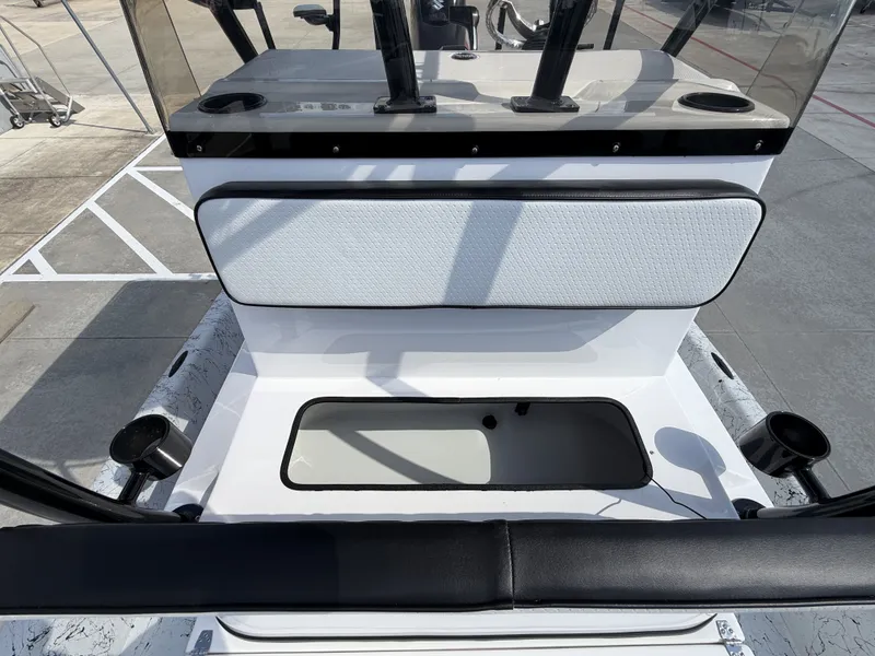 Slide: The Image of The image shows the cockpit of a 2026 Dargel 250 Kat HDX with a cushioned seat and storage. - 30