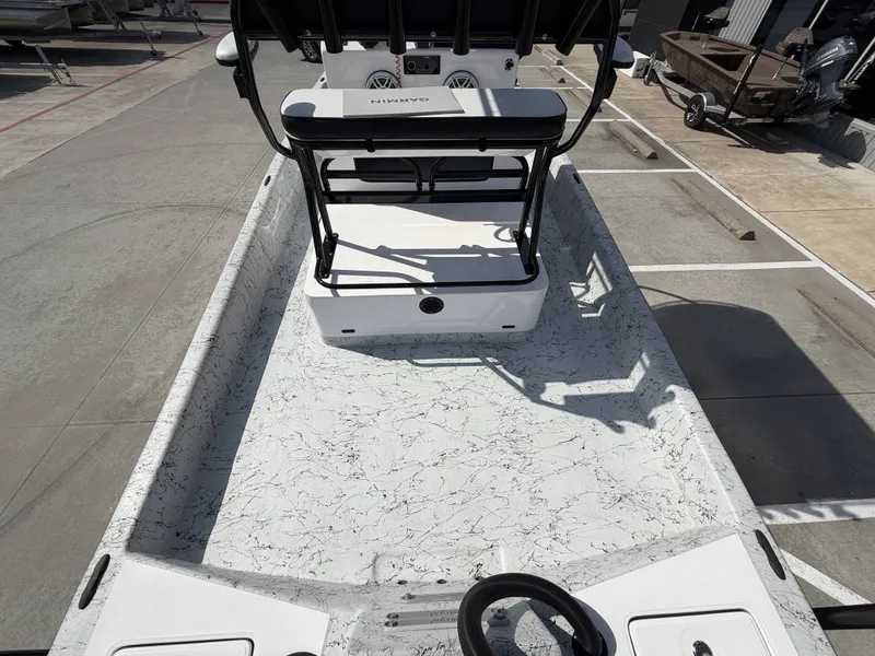 Slide: The Image of The image shows a 2026 Dargel 250 Kat HDX boat. It features an open deck with a central console and textured flooring. - 13