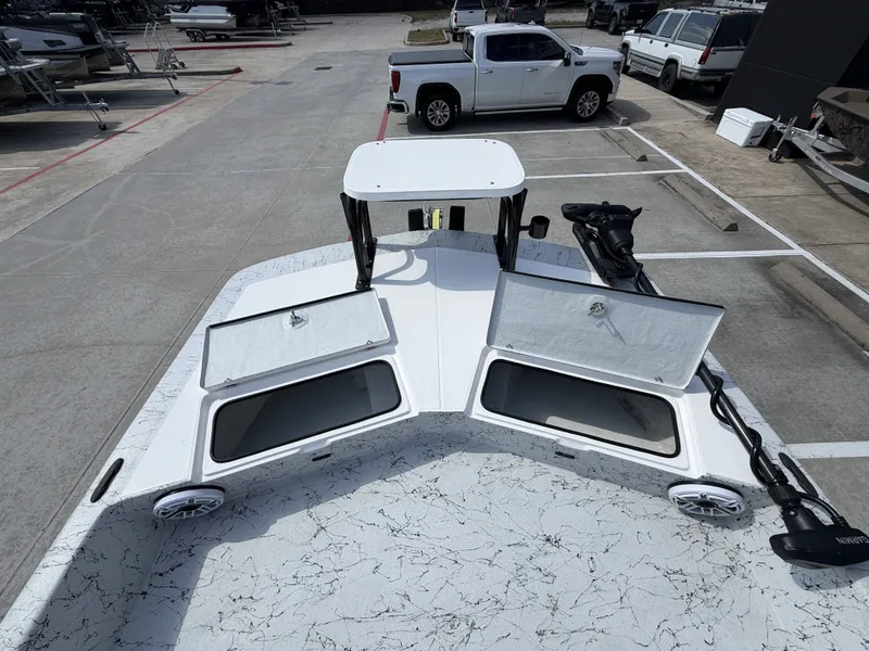 Slide: The Image of The image shows the deck of a 2026 Dargel 250 Kat HDX with open storage compartments. - 26