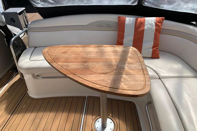 Slide: The Image of Luxurious 2011 Sea Ray Sundancer 370 interior with wooden table and striped cushion. - 27