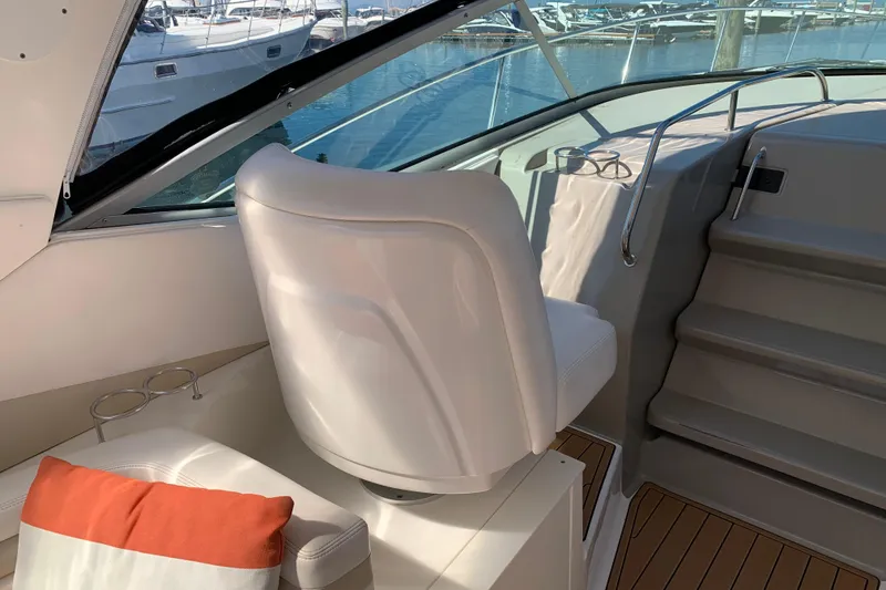 Slide: The Image of Interior of 2011 Sea Ray Sundancer 370 yacht with white seating and wooden flooring. - 22