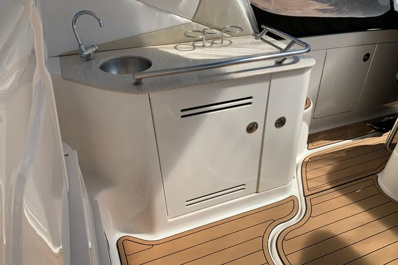 Slide: The Image of 2011 Sea Ray Sundancer 370 yacht interior with sink and wooden flooring. - 25