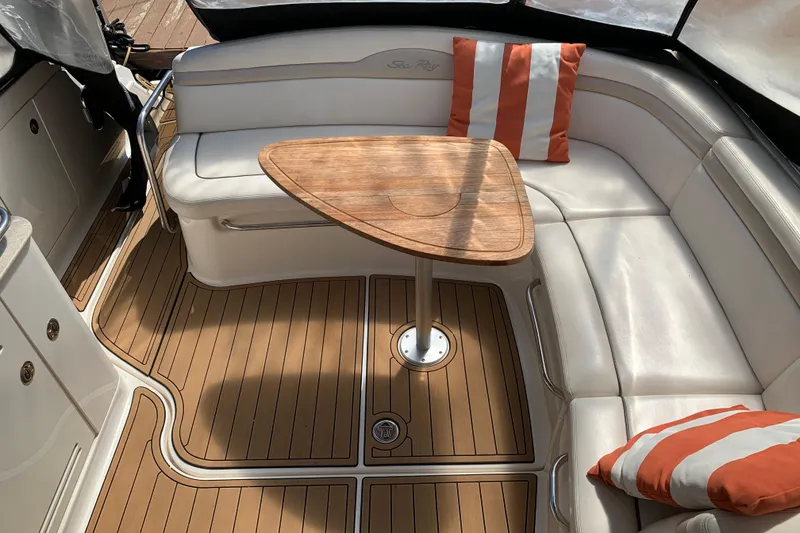 Slide: The Image of Luxurious 2011 Sea Ray Sundancer 370 interior with white seating and wooden table. - 24
