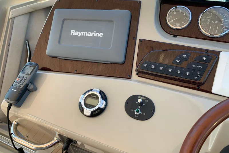 Slide: The Image of Control panel of a 2011 Sea Ray Sundancer 370 with Raymarine equipment. - 34