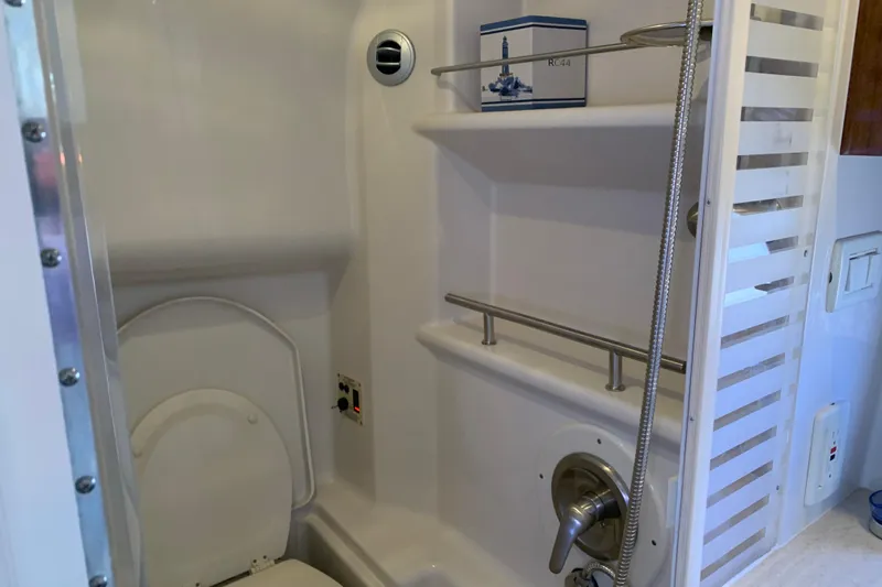 Slide: The Image of 2011 Sea Ray Sundancer 370 bathroom with shower and toilet, featuring modern fixtures. - 44