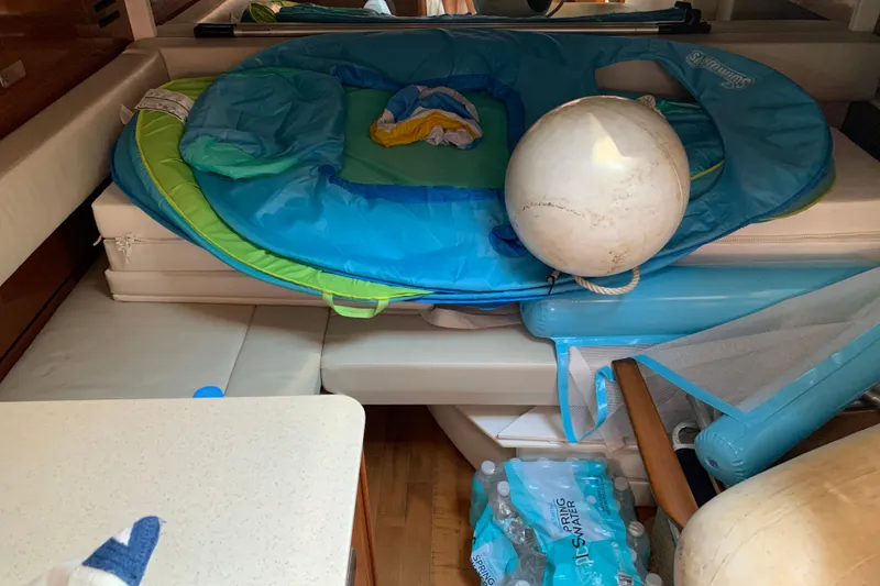 Slide: The Image of Interior of 2011 Sea Ray Sundancer 370 with pool floats and water bottles. - 42