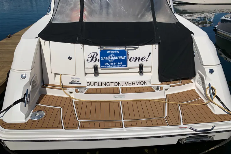 Slide: The Image of 2011 Sea Ray Sundancer 370 docked in Burlington, Vermont, with teak-style decking. - 18