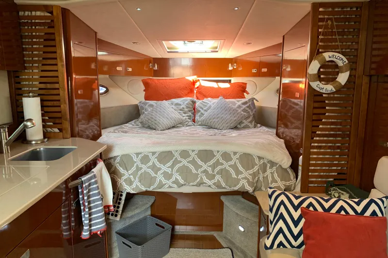 Slide: The Image of Luxurious cabin interior of a 2011 Sea Ray Sundancer 370 yacht with cozy bedding. - 37
