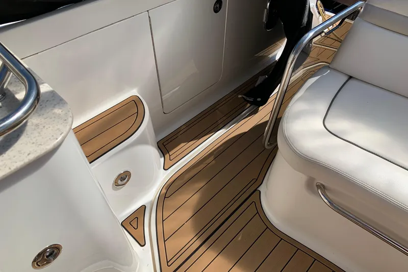 Slide: The Image of Luxurious interior of 2011 Sea Ray Sundancer 370 with teak flooring and white seating. - 28