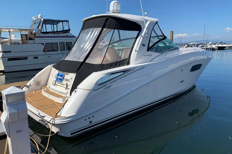 Slide: The Image of 2011 Sea Ray Sundancer 370 docked at marina, clear blue sky. - 15