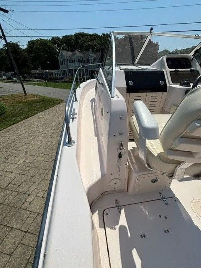Slide: The Image of 2007 Grady-White Journey with helm and seating, parked on a paved path. - 14