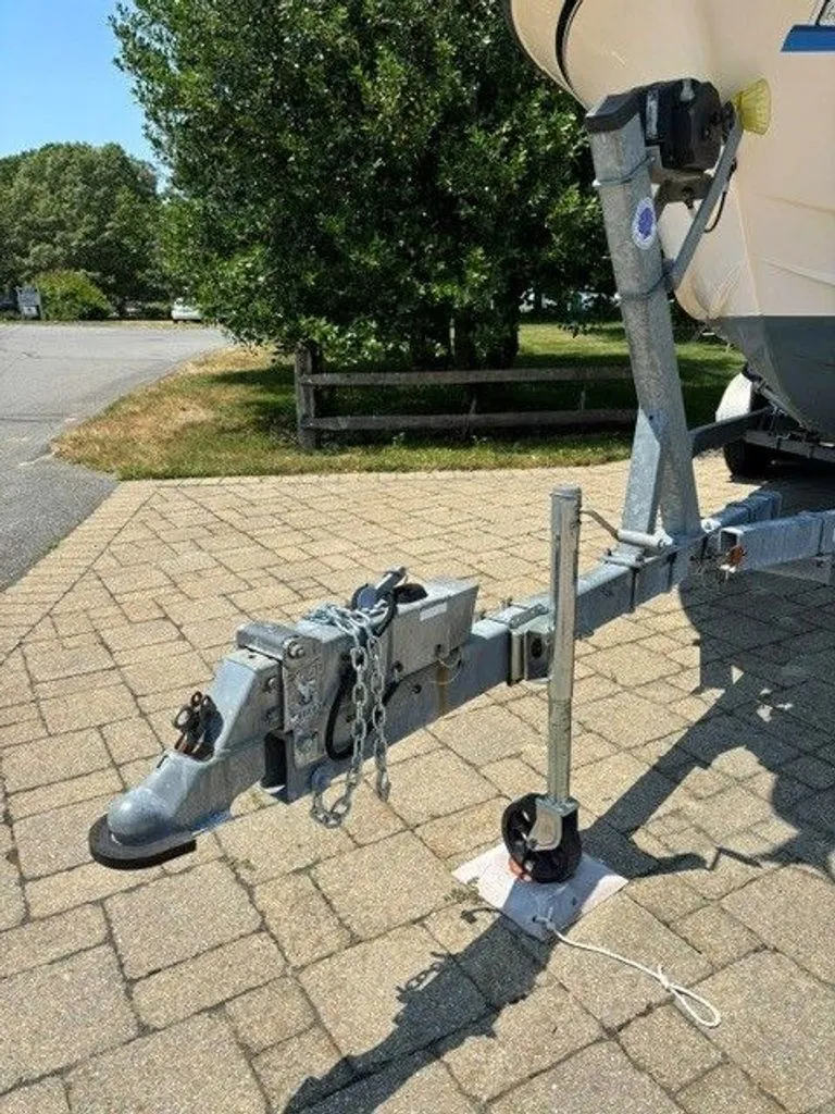 Slide: The Image of The trailer of a 2007 Grady-White Journey boat is parked on a paved path. - 22
