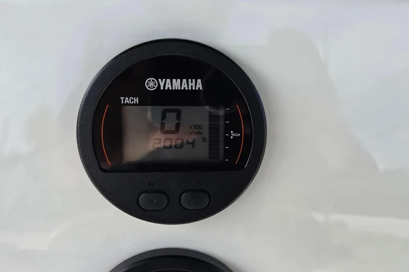Slide: The Image of Yamaha tachometer on 2022 Key West 189 FS boat, displaying 2004 hours. - 17