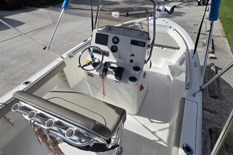 Slide: The Image of 2022 Key West 189 FS boat interior with steering console and seating. - 13