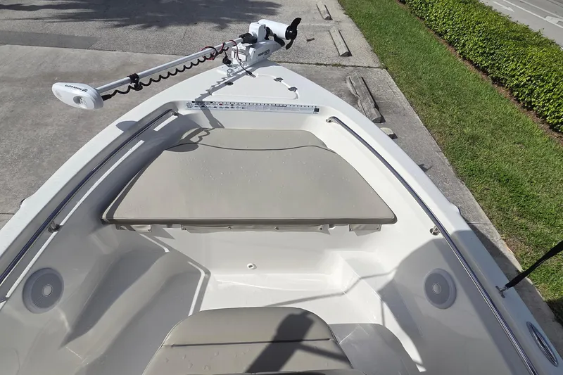 Slide: The Image of 2022 Key West 189 FS boat with trolling motor and cushioned seating. - 5