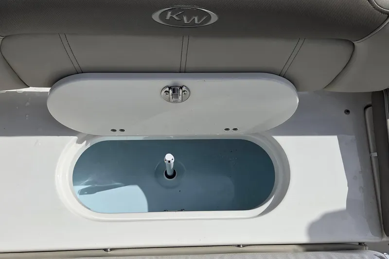 Slide: The Image of 2022 Key West 189 FS boat livewell with open lid, showcasing interior design. - 7