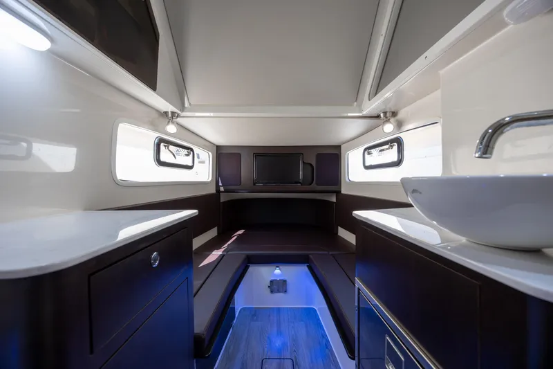 Slide: The Image of Luxurious interior of 2019 Scout 355 LXF boat with modern amenities and sleek design. - 36