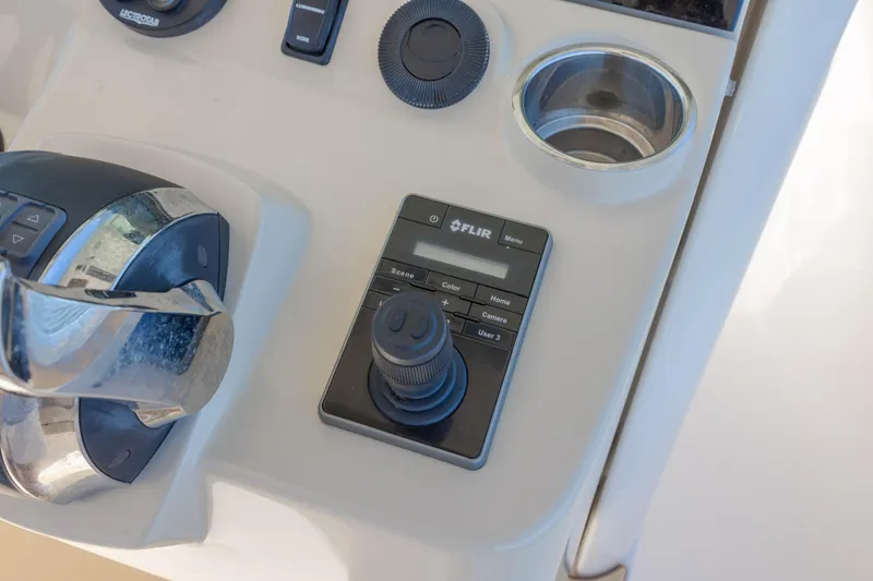Slide: The Image of Control panel of a 2019 Scout 355 LXF boat featuring FLIR joystick and throttle. - 25