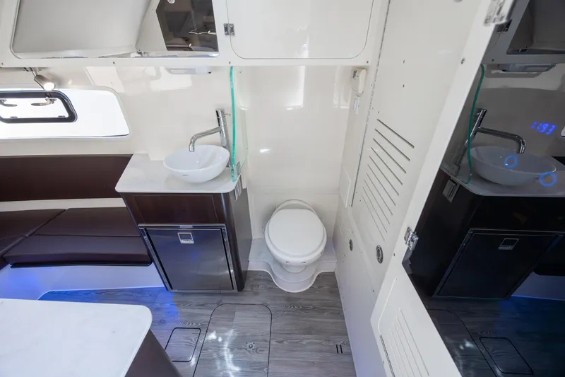 Slide: The Image of Luxurious 2019 Scout 355 LXF boat interior with modern bathroom amenities. - 42