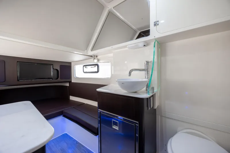 Slide: The Image of Luxurious interior of 2019 Scout 355 LXF boat with modern amenities and sleek design. - 41