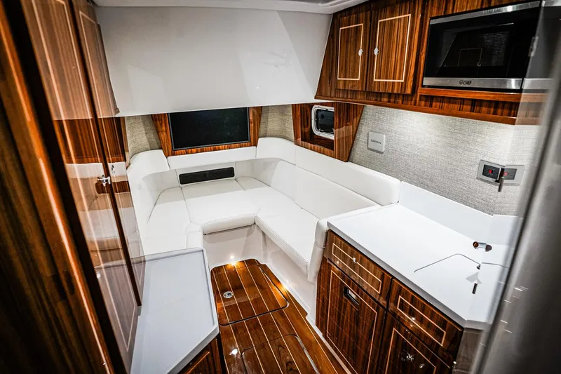 Slide: The Image of Luxurious interior of 2027 HCB 48 Campeon boat with elegant wood finishes and modern amenities. - 3