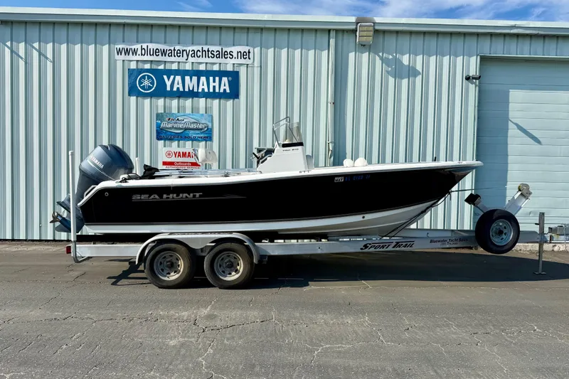 Slide: The Image of 2012 Sea Hunt Triton 210 boat on trailer, parked outside Bluewater Yacht Sales. - 3
