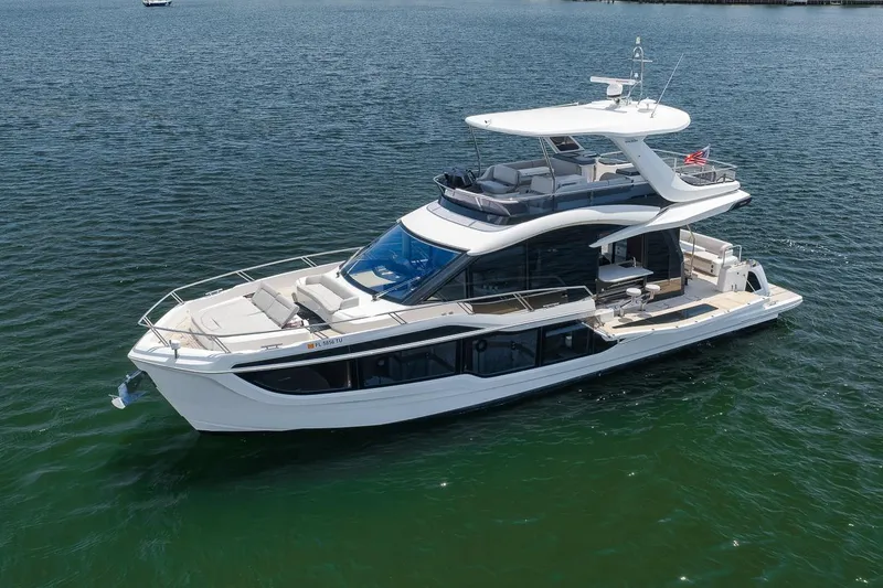 Slide: The Image of 2022 Galeon 560 Fly yacht cruising on open water, showcasing sleek design and luxury features. - 14