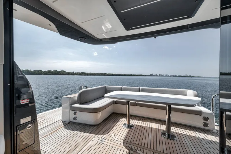 Slide: The Image of Luxury yacht Galeon 560 Fly 2022 with elegant deck seating and scenic water view. - 45