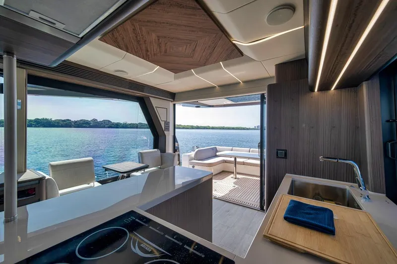 Slide: The Image of Luxurious interior of 2022 Galeon 560 Fly yacht with modern kitchen and scenic water view. - 42