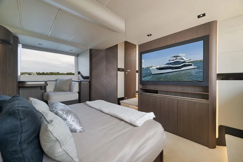Slide: The Image of Luxurious interior of 2022 Galeon 560 Fly yacht with modern bedroom and large TV. - 59