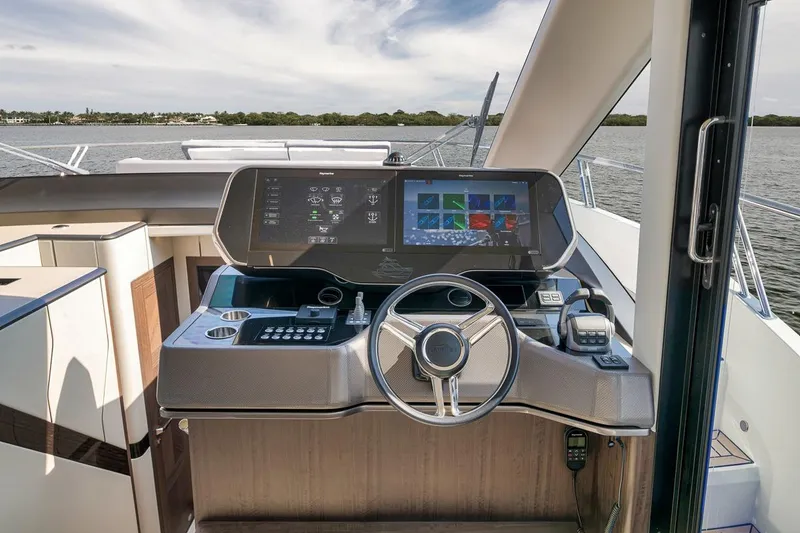 Slide: The Image of Helm of 2022 Galeon 560 Fly yacht with advanced navigation system and sleek design. - 34