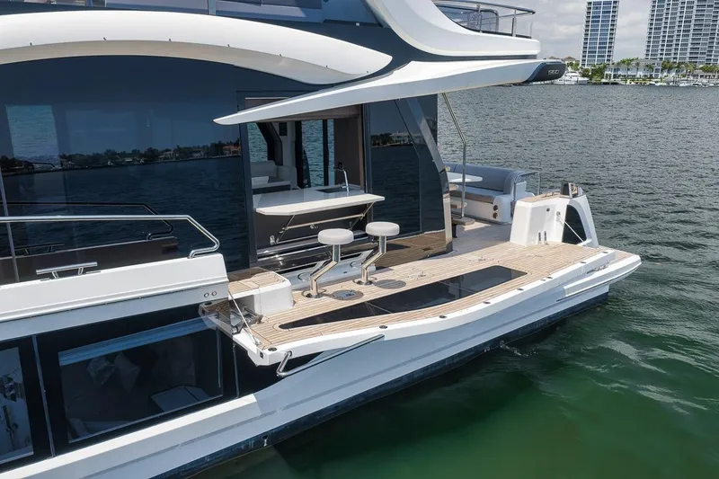 Slide: The Image of 2022 Galeon 560 Fly yacht with sleek design and spacious deck on calm waters. - 30