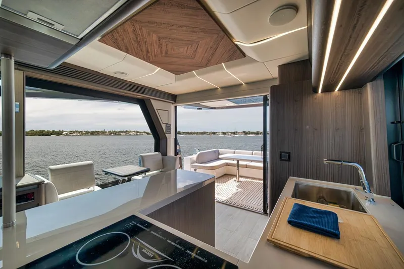 Slide: The Image of Interior of 2022 Galeon 560 Fly yacht with modern kitchen and scenic water view. - 41