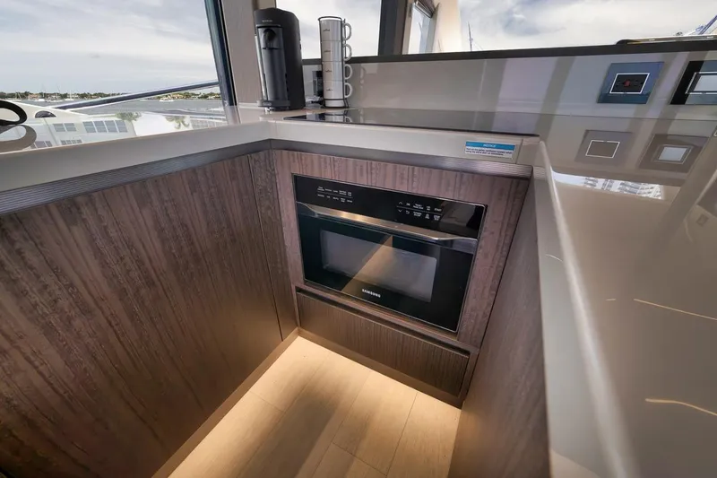 Slide: The Image of Modern kitchen area in 2022 Galeon 560 Fly yacht with built-in Samsung oven. - 96