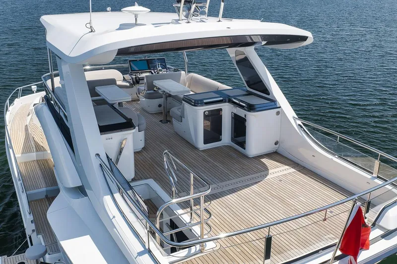 Slide: The Image of Luxury 2022 Galeon 560 Fly yacht with spacious deck and modern amenities on water. - 20